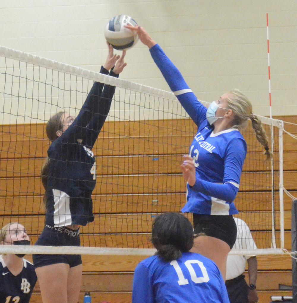 Pine Bush’s Monica Ilioiu and Valley Central’s Riley Schoonmaker compete at the net as Autumn Singelton looks on during Thursday’s OCIAA Division II volleyball game at Pine Bush High School.